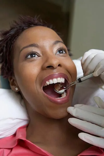 woman getting a checkup after having her wisdom teeth removed at Afdent in Mishawaka, IN