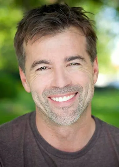 man smiling after having his smile restored at Afdent in Mishawaka, IN